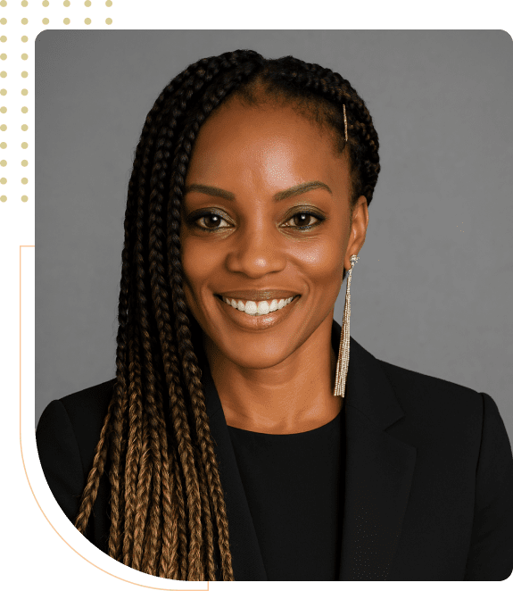 Smiling woman with braided hair and earrings.